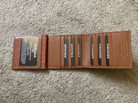 SEDONA® Sleek bifold leather wallet with side flap, 18 card slots, and ID window for organized style