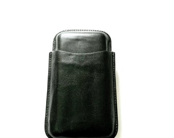 May include: A black leather phone case with a flap closure.