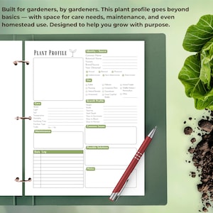 May include: A green binder with a plant profile page open, featuring sections for care, growth, and maintenance. A red pen rests on the page. The text reads: "Built for gardeners, by gardeners. This plant profile goes beyond basics - with space for care needs, maintenance, and even homestead use."
