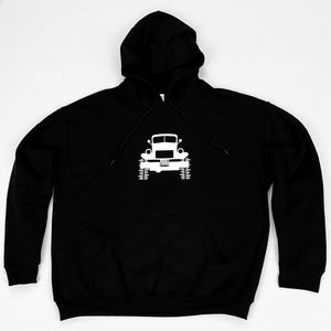 May include: Black hooded sweatshirt with a white silhouette of a vintage truck on the front.
