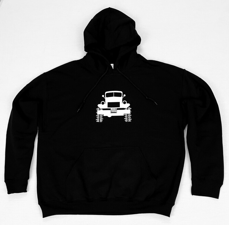 May include: Black hooded sweatshirt with a white silhouette of a vintage truck on the front.