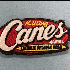 May include: Embroidered patch with the words "Killing Canes" in white script over a red background. The patch also includes the text "4 APRIL" and "LITTLE HELLPAC 2023" in yellow and white.