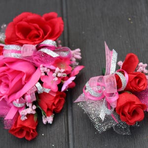 Wrist Corsage and Boutonniere Set. Homecoming Corsage and Boutonniere Set. Prom corsage wedding or dance. Pink, red, and silver