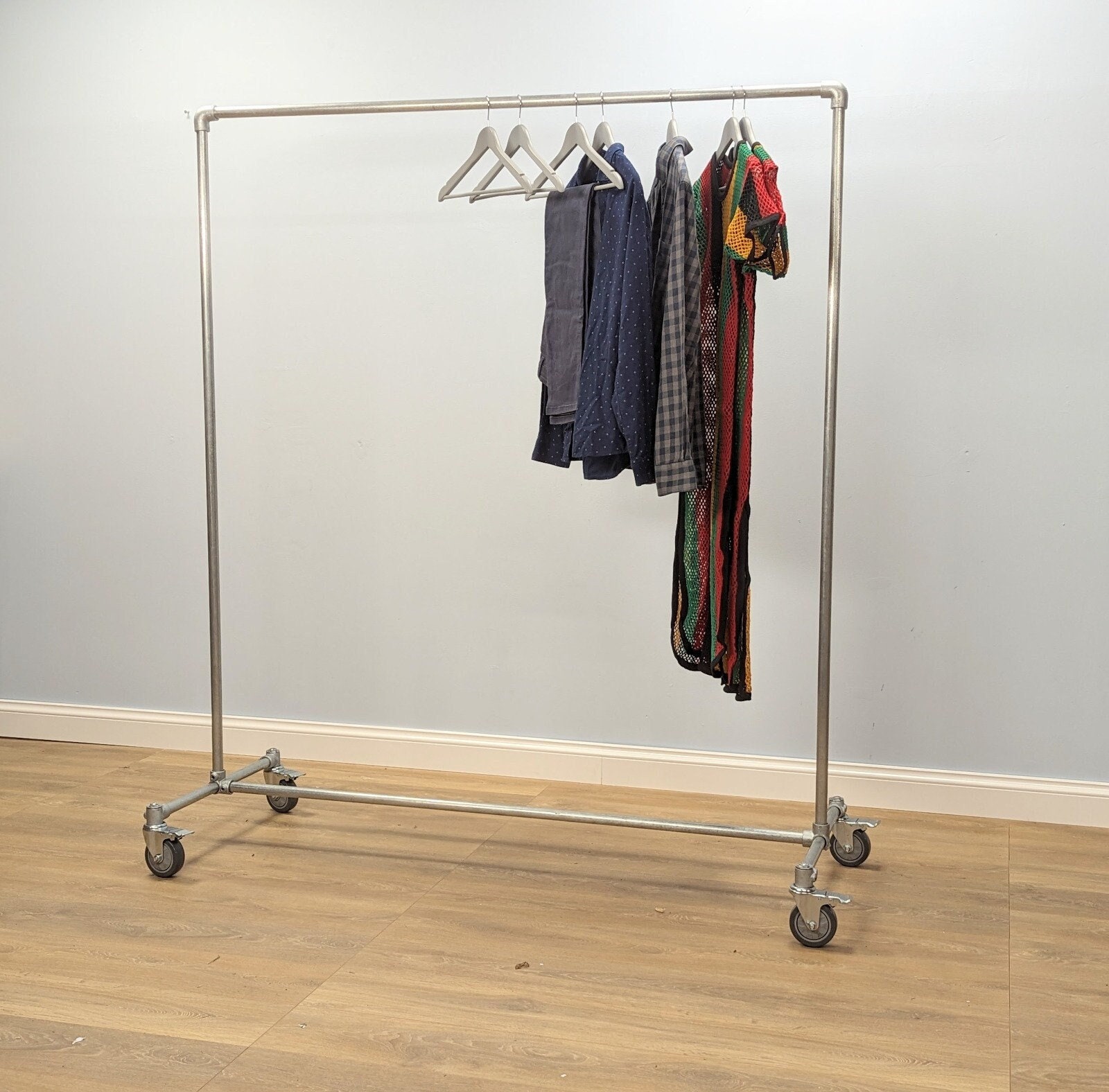 Metal clothes rack with wheels hotsell