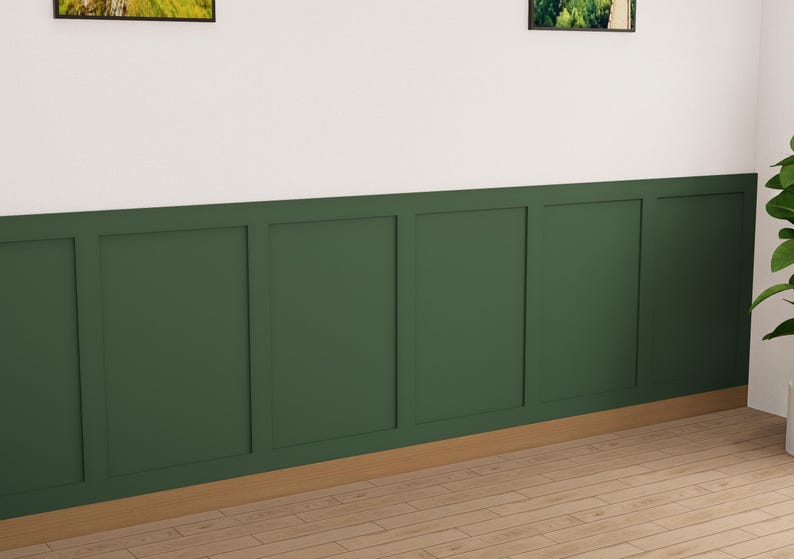 May include: A wall with a dark green wainscot paneling with a white top. The paneling has a raised design with vertical and horizontal lines. The floor is a light wood.