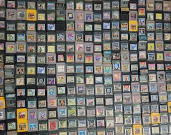 May include: A large collection of vintage Game Boy game cartridges. The cartridges are in various colours, including grey, yellow, and black, and feature colourful game labels. The image showcases a wide array of classic video game titles.