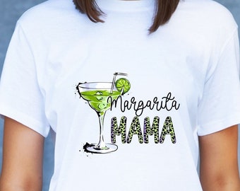 May include: White t-shirt with a graphic of a margarita glass with a lime wedge and the text "Margarita Mama" in black and green.