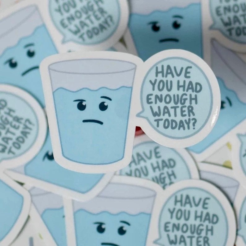 May include: A sticker featuring a cartoon glass of water with a sad face. A speech bubble says, "Have you had enough water today?" The sticker is light blue and white, with other similar stickers in the background.