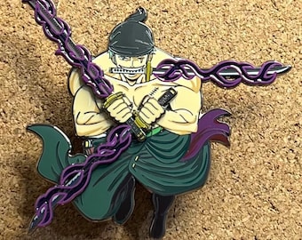 May include: Enamel pin featuring a character with three swords, wearing a black head covering and green clothing. The character is holding two swords with purple energy emanating from them. The pin has a gold and purple color scheme.