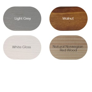 May include: A collection of 11 wood stain colour samples in oval shapes. The colours include Tudor Oak, Light Grey, Walnut, Dark Oak, Seasoned Oak, White Gloss, Natural Norwegian Red Wood, Mahogany, Ebony Black, and Light Oak.