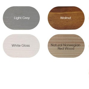 May include: A collection of wood stain color samples in oval shapes. The colors include Tudor Oak, Light Grey, Walnut, Dark Oak, Seasoned Oak, White Gloss, Natural Norwegian Red Wood, Mahogany, Ebony Black, and Light Oak.