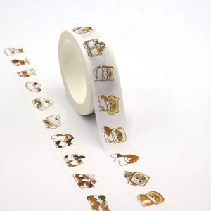 May include: A roll of white washi tape featuring a repeating pattern of adorable cartoon cats in various poses. The cats are depicted in shades of brown, tan, and white. The tape is ideal for scrapbooking, crafting, and adding a cute touch to any project.