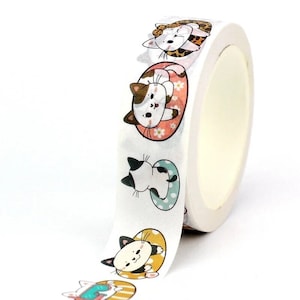May include: A roll of white washi tape with a repeating pattern of cute cartoon cats wearing colorful floaties. The cats are in various poses and have different colored fur.