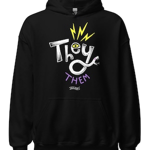 May include: Black hoodie with the words "They Them" in a white, handwritten font. The word "They" is above an eye graphic and yellow lightning bolts. The word "Them" is in purple, with a snake-like design. The hoodie has a drawstring hood.