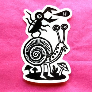 May include: A black and white sticker featuring a whimsical illustration. A snail with long, dotted antennae and a spiral shell is depicted with a bug on top. The bug has a speech bubble that says "HI". Mushrooms are at the bottom.