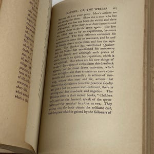 May include: Open book with text on aged paper. The page features the title "GOETHE, OR, THE WRITER" and paragraphs of printed text. The paper has a yellowed hue, suggesting age and use. The book is open to a specific page.