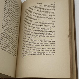 May include: Open book with text on aged paper. The text includes the word "Shakespeare" and other literary references. The pages are yellowed, suggesting age. The book is open to a section titled "NOTES".