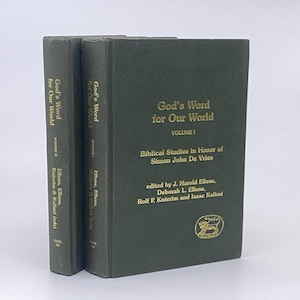 May include: Two dark green hardback books titled God's Word for Our World, Volume I and Volume II. The front cover of Volume I features gold text and a small gold lion emblem. The spines also display the title and editors in gold lettering.