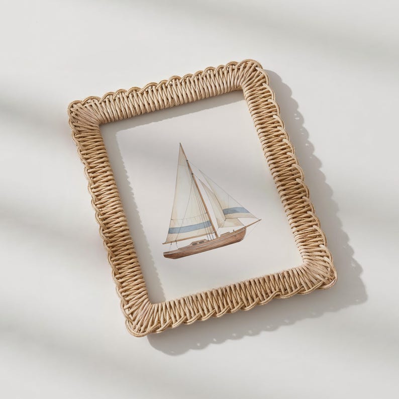 May include: A rectangular woven frame in a light beige color surrounds a watercolor painting of a sailboat. The sailboat has a brown hull, white sails with blue stripes, and a tall mast. The frame has a scalloped edge.