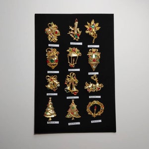 Vintage Gold plated Christmas Brooches from the 1970s.  12 styles.