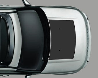 May include: A silver SUV with a black roof rack and a black sunroof. The vehicle has a black hood wrap with a small black emblem on the hood.