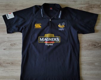 Canterbury London Wasps Größe L-XL 2005-2006 Heim-Trikot Polo T-Shirt Rugby Football Club Union Team Kurzarm Schwarz Magners Irish Cider