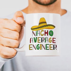 May include: White ceramic mug with a colorful illustration of a sombrero and the text "Nacho Average Engineer".