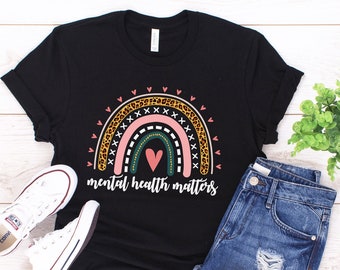 May include: Black t-shirt with a rainbow design featuring a heart and the text "mental health matters".