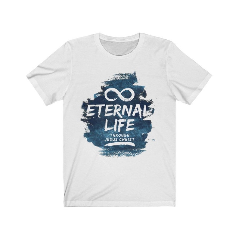 May include: White t-shirt with a blue watercolor design featuring an infinity symbol and the text "Eternal Life Through Jesus Christ".