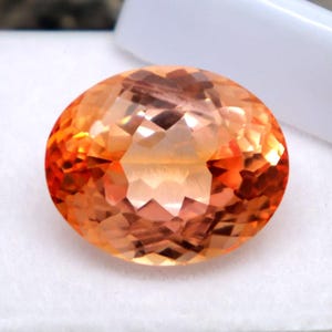 Saphir Padparadscha de Ceylan (Sri Lanka) Pierre naturelle AAA non fixée, taille ovale de 15,6 carats, couleur orange, saphir Padparadscha, pierre certifiée à facettes