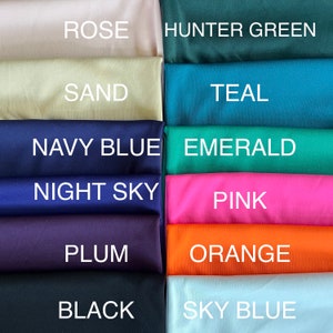 May include: A collection of fabric swatches in various colors, including rose, hunter green, sand, teal, navy blue, emerald, night sky, pink, plum, orange, black, and sky blue.