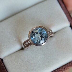 Round Blue Topaz Ring Bezel Set Blue Topaz Ring in 925 sterling silver 10mm Blue Topaz center with White Topaz sides December Birthstone