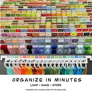 May include: An organised display of embroidery threads, showing a range of colours and numbers. The image features a variety of thread colours, from reds and pinks to blues and greens, with labels and a hanging system. Text reads "ORGANIZE IN MINUTES."
