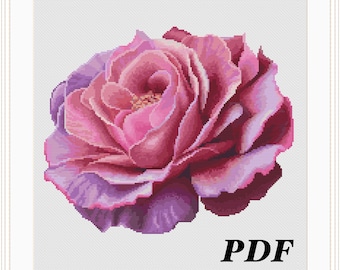 May include: A cross stitch pattern featuring a single pink rose with purple highlights. The pattern is labeled "PDF" in the bottom right corner.