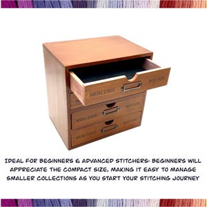 May include: A wooden drawer organizer with four drawers labeled "Mercerie" and "Bouton". The top drawer is open, revealing a black interior.