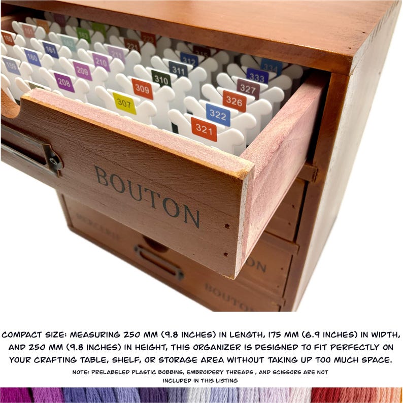 May include: Wooden organizer with four drawers for storing embroidery floss. The top drawer is open, revealing white plastic bobbins labeled with numbers. The organizer measures 9.8 inches in length, 6.9 inches in width, and 9.8 inches in height.