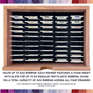 May include: A wooden storage box with four drawers for storing up to 200 embroidery bobbins. Each drawer has a foam insert with slots for up to 50 bobbins.  The box is labeled "HOLDS UP TO 200 BOBBINS: EACH DRAWER FEATURES A FOAM INSERT WITH SLOTS FOR UP TO 50 REGULAR IMM PLASTIC BOBBINS, GIVING YOU A TOTAL CAPACITY OF 200 BOBBINS ACROSS ALL FOUR DRAWERS".  The text "NOTE: PRELABELED PLASTIC BOBBINS, EMBROIDERY THREADS, AND SCISSORS ARE NOT INCLUDED IN THIS LISTING" is also visible.