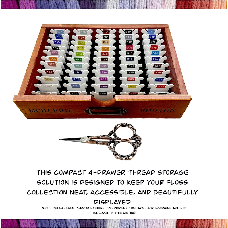 May include: A wooden thread storage box with four drawers labeled "Mercerie" and "Bouton". The box is filled with small plastic bobbins, each labeled with a number. A pair of antique-style scissors is in front of the box. The text below the box reads "This compact 4-drawer thread storage solution is designed to keep your floss collection neat, accessible, and beautifully displayed. Note: Prelabeled plastic bobbins, embroidery threads, and scissors are not included in this listing."