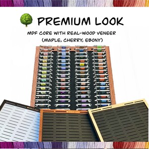May include: A wooden yarn organizer with the text "PREMIUM LOOK" and "MDF CORE WITH REAL-WOOD VENEER (MAPLE, CHERRY, EBONY)". The organizer has multiple slots for yarn, with color-coded labels. Additional organizer boards are visible.