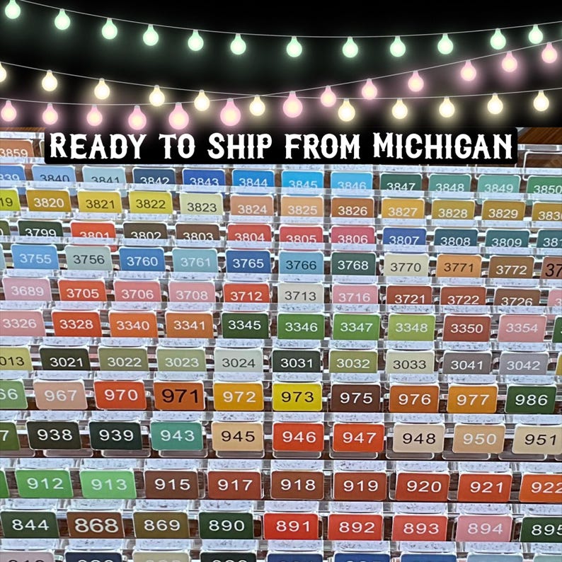 May include: A display of numbered tags in a variety of colours, such as green, orange, and brown. The text "READY TO SHIP FROM MICHIGAN" is at the top. The tags are arranged in rows and columns, with numbers ranging from 3859 to 895.