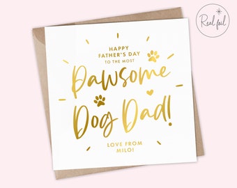 May include: A Father's Day card with gold foil lettering on a white background. The text reads "Happy Father's Day to the Most Pawsome Dog Dad! Love from Milo!" A paw print and heart are also included.