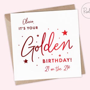 May include: A white card with red foil lettering that says "Olivia, It's your Golden Birthday! 21 on the 21st".