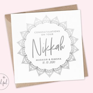 May include: A white card with a silver mandala design and the text "Congratulations on your Nikkah Mudasir & Rimsha 10.10.2020".