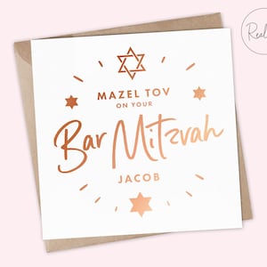 May include: A white card with a copper foil design. The card says "Mazel Tov on your Bar Mitzvah Jacob" with a Star of David in the top center and smaller stars on the sides.