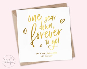 May include: Gold foil anniversary card with the text "one year down, forever to go!" and the names "MR & MRS WILLIAMS" and the date "est. 26.10.2019".