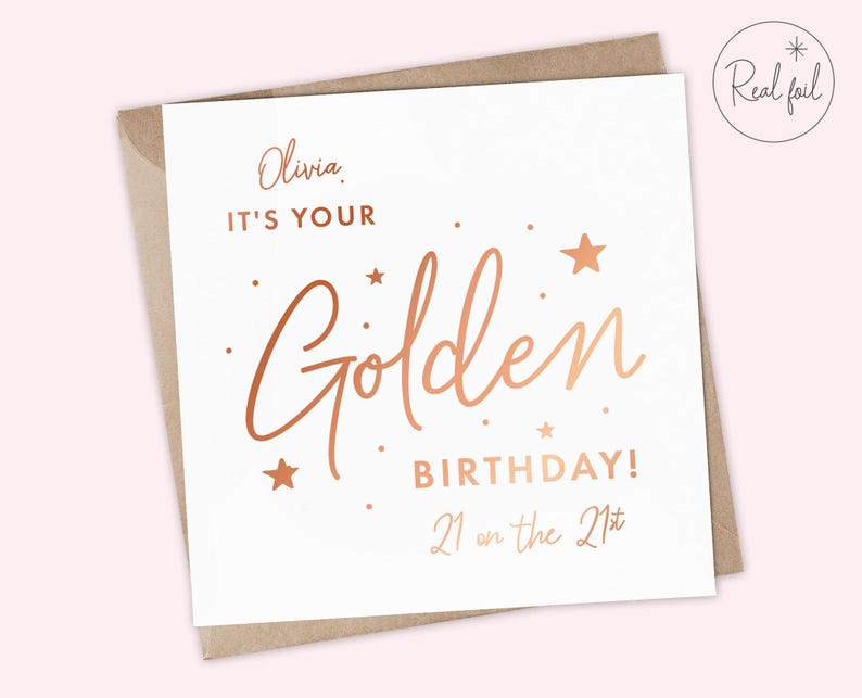 May include: A white card with gold foil lettering that says "Olivia, It's your Golden Birthday! 21 on the 21st".
