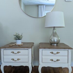 NEW!!! Absolutely stunning pair of vintage French provencial nightstands/End tables finished in Antique white color with stained top.