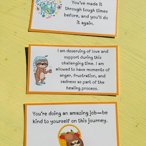 May include: Three rectangular cards with orange borders and white backgrounds. Each card features text and a sloth illustration. The top card reads "You've made it through tough times before, and you'll do it again."
