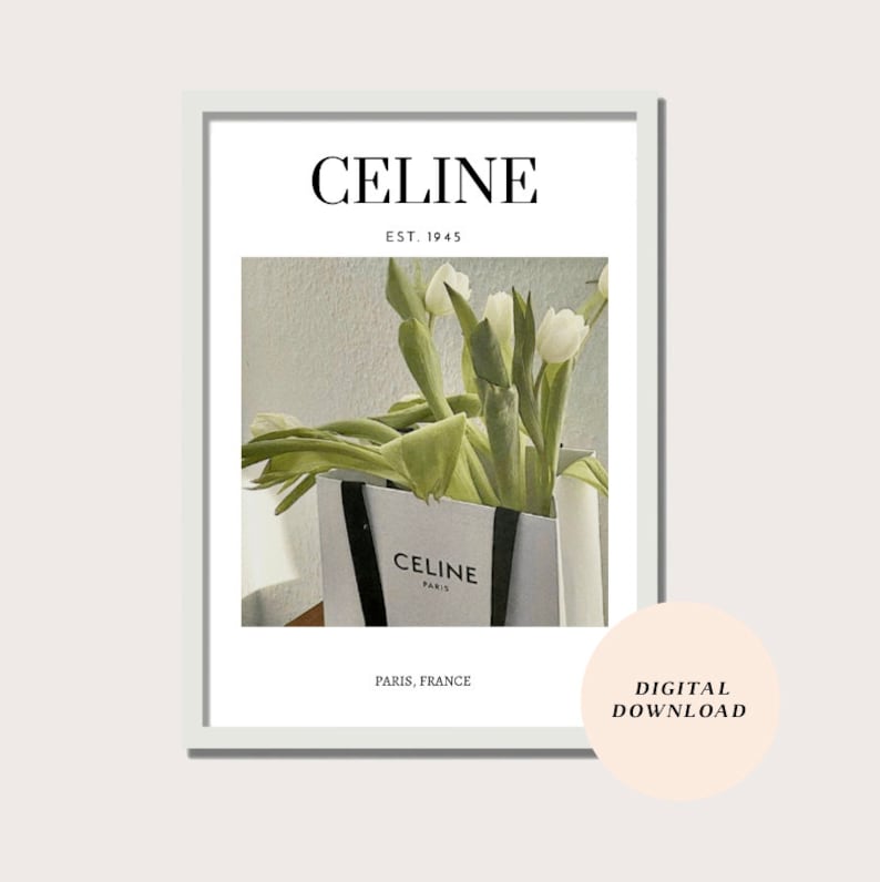 May include: A white shopping bag with black handles and the text "CELINE PARIS" printed on the front. White tulips are arranged inside the bag. The text "CELINE EST. 1945 PARIS, FRANCE" is printed below the image. The text "DIGITAL DOWNLOAD" is printed in a circle on the right side of the image.