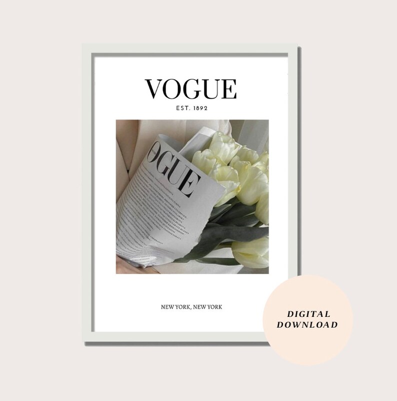 May include: A white framed print with the text "VOGUE EST. 1892 NEW YORK, NEW YORK" and a photo of a bouquet of white tulips wrapped in a Vogue magazine.